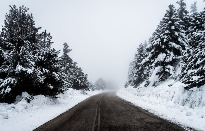 photograph of a road with snow