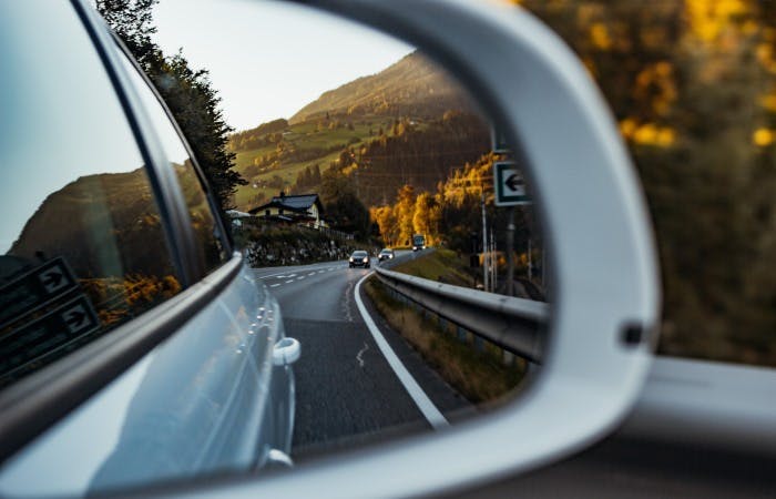 photograph through a car's rearview wing mirror