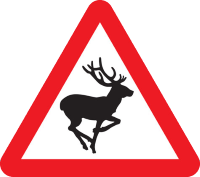 A warning triangle road sign with a graphic of a deer representing the potential hazard of wild animals