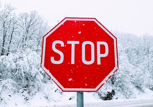 A stop sign in the snow