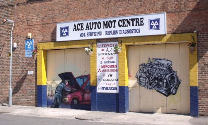 Photograph of the exterior of an MOT mechanics garage