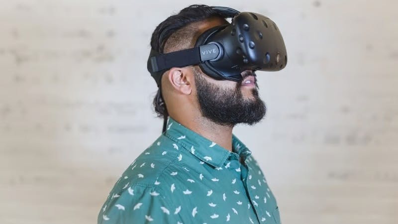 Man wearing a VR headset, which may be used to take the theory test in 20 years