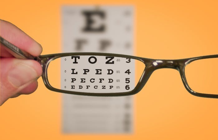 Pair of glasses looking at eyesight optician test