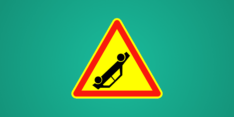 Accident sign depicting overturned car