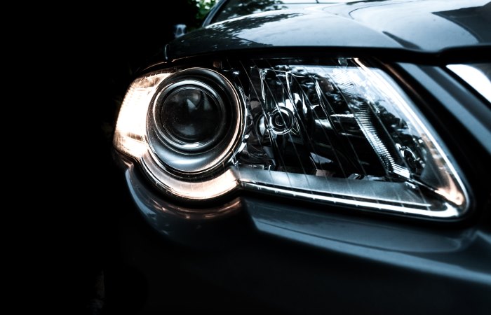 close-up-of-headlight-on-black-car