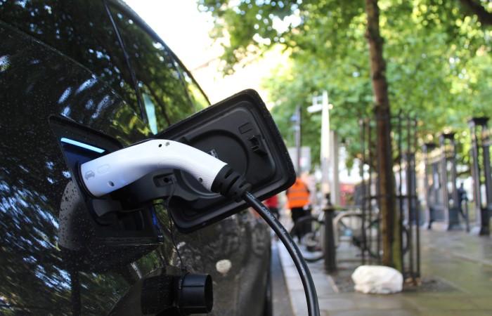close-up-of-black-electric-car-charging-outside