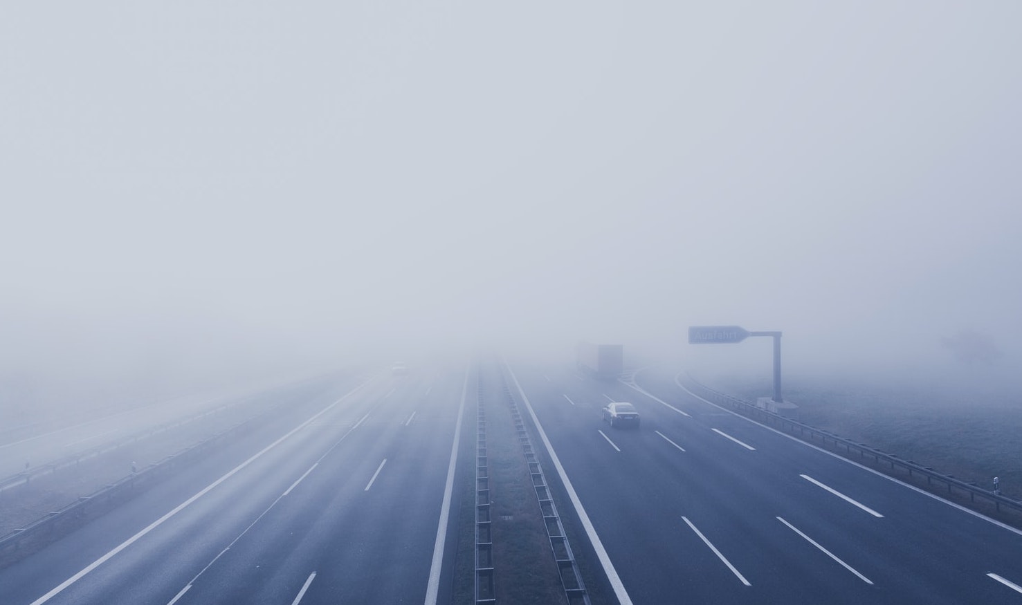 Motorway with poor visibility due to fog