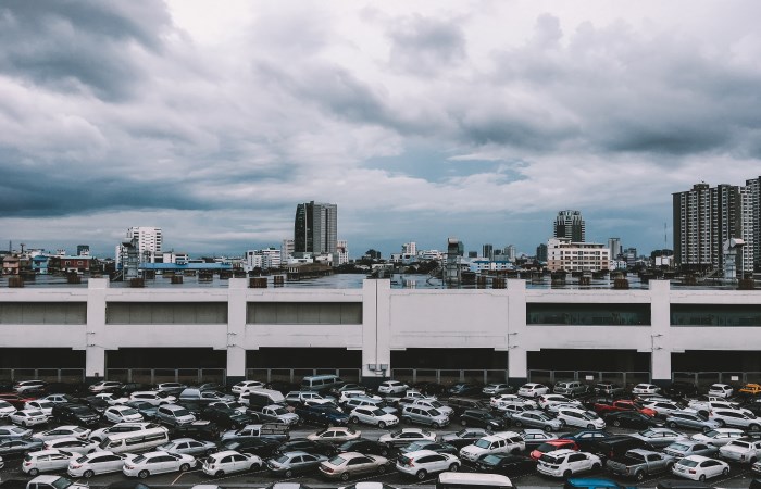 full-car-park-with-clouds-in-sky