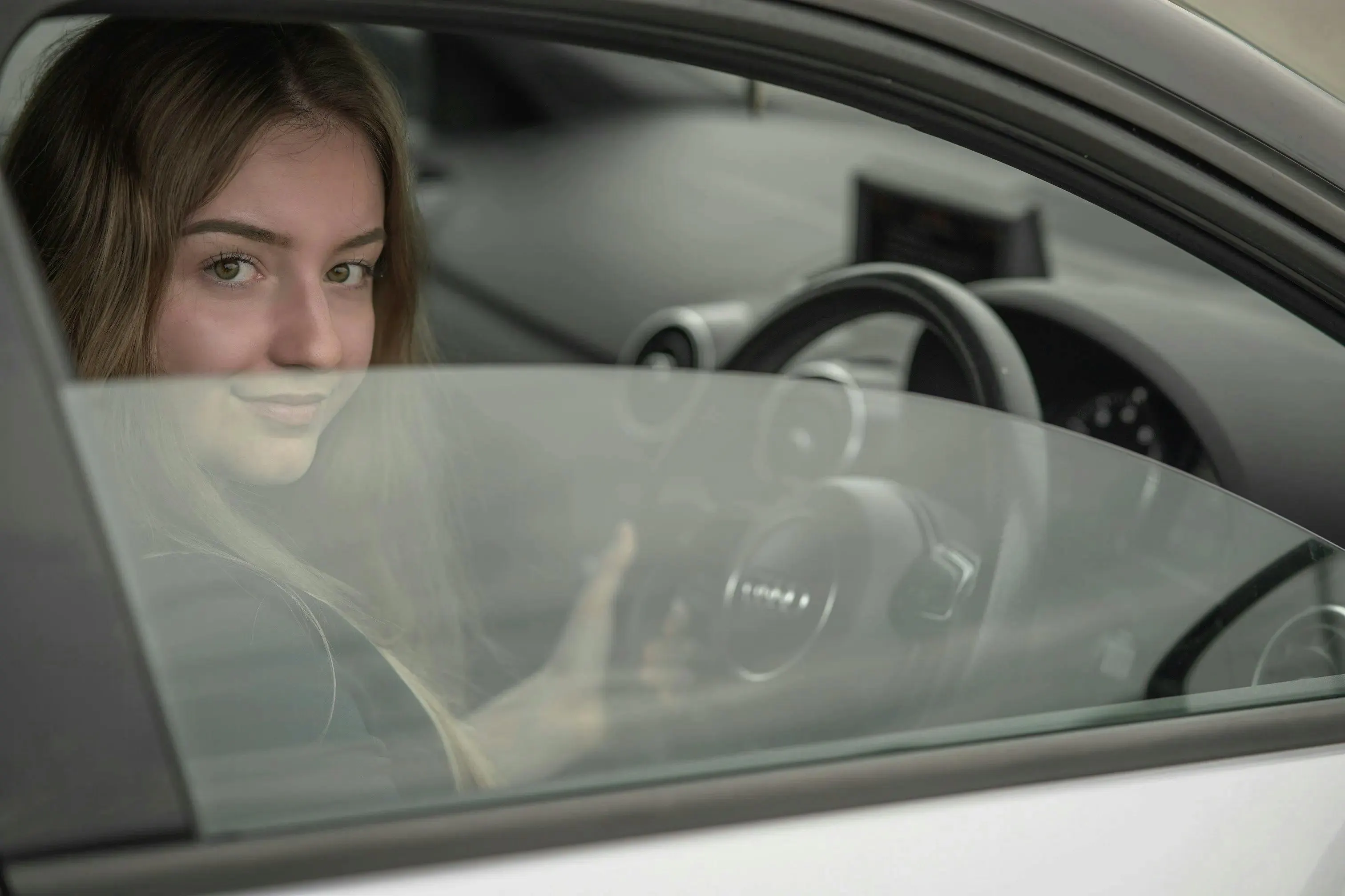 A female learner driver taking an Intensive Driving Course