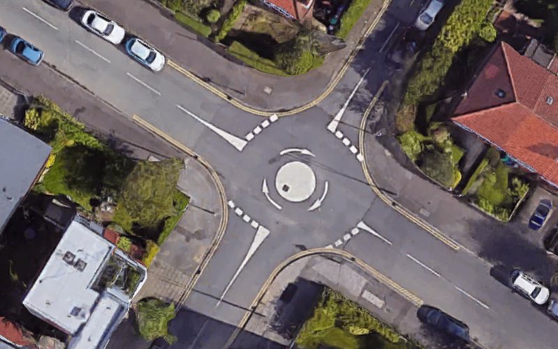 A bird's-eye view of a mini roundabout in Manchester.