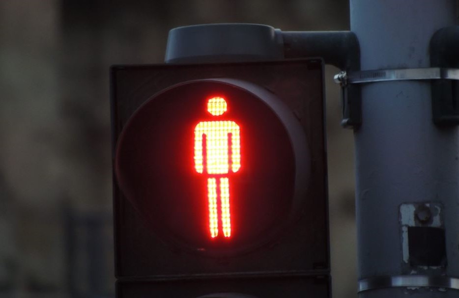 Red man symbol highlighted on traffic light